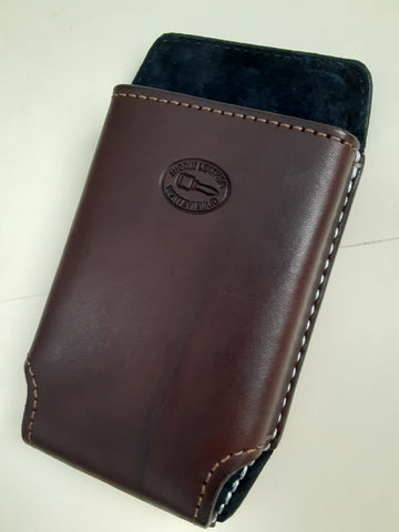 Brown custom leather phone case/holster for belt. Slip design. No lid. Brown and white stitching. Inner pigskin lining. 