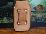 Tan leather cell phone case. Back side. Copper riveted belt slot