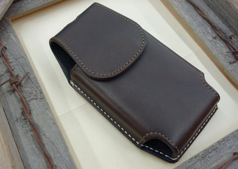brown leather cell phone case for belt. Magnetic closure. Brown and white stitching. 